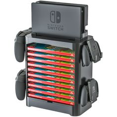 the nintendo switch game system is stacked on top of each other and has several controllers attached to it