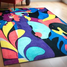 a colorful area rug with an abstract design