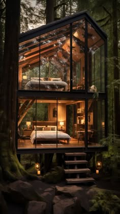 a cabin in the woods with stairs leading up to it's bedroom and living area