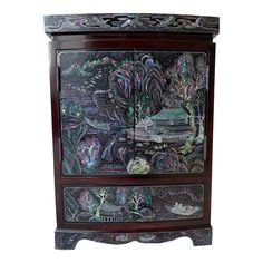 an ornate wooden cabinet with painted designs on it