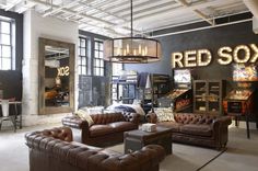 a living room filled with lots of brown furniture