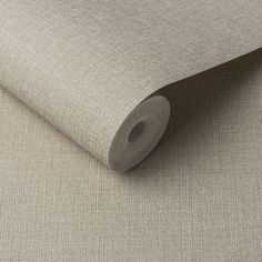 a roll of grey fabric on top of a table