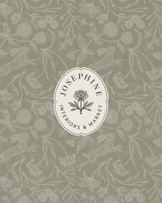 the logo for joe sepieve interiors and market on a gray background with white flowers