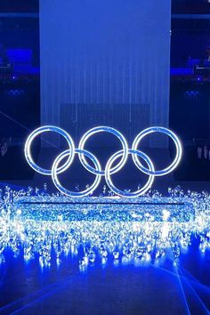 the olympic rings are lit up at night