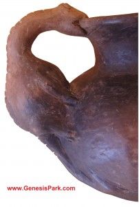 a close up of a brown vase on a white background