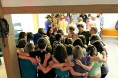 a group of young people hugging each other