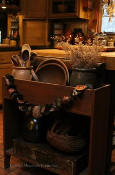 an old wooden cabinet filled with pots and pans