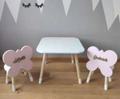 three children's wooden chairs and table with name on them