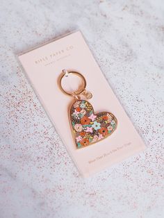 Wear your heart on your keys with our enamel Floral Heart keychain, featuring a glossy finish. Details: 2" L × 2" W Brass Printed in full color 1" keyring Polished enamel with glossy finish Keychain Packaging, Enamel Keychain, Wedding Gift Guide, Curated Wedding, Lifestyle Accessories, Crosses Decor, Keychain Design, Heart Keychain, Floral Heart