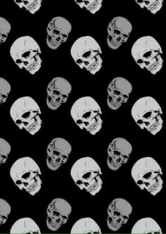 black and white skulls on a black background with green border in the center is a ruler