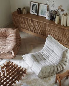 a living room filled with furniture and decor