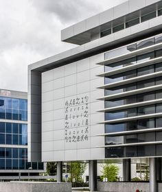 a building with writing on the side of it and two fire hydrants in front