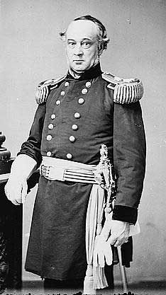 an old black and white photo of a man in uniform