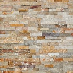 a stone wall with different colors and shapes