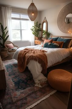 a bed room with a neatly made bed and lots of pillows on top of it