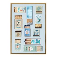 an assortment of matches are displayed in a wooden frame on a blue background with the words aloha written above them