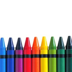 several crayons lined up in front of each other on a white background photo