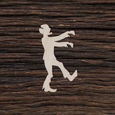 the silhouette of a man is shown on wood