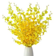 a white vase with yellow flowers in it