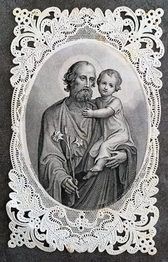 an old photo of a man holding a child