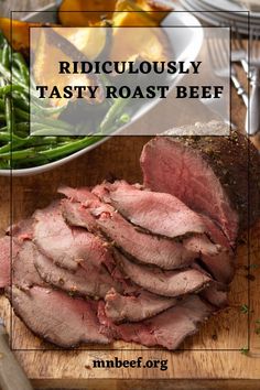 sliced roast beef sitting on top of a wooden cutting board