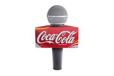 a microphone that is sitting on top of a box with a coca - cola sign