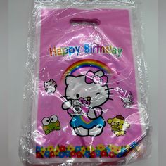 a pink hello kitty birthday bag with an image of the hello kitty on it's back