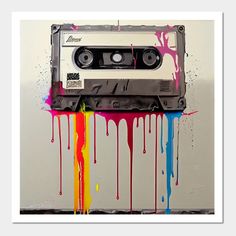 an old tape recorder with paint splattered on it and the word love is written in