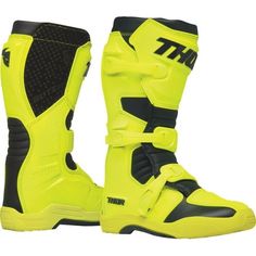 a pair of yellow and black motorbike boots with the words thor written on them