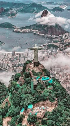 an aerial view of the statue of christ on top of a mountain in rio, brazil