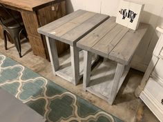 two wooden tables sitting next to each other on top of a rug in a room