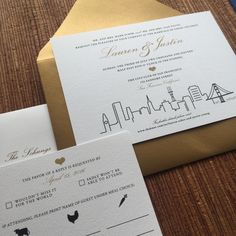 the wedding stationery was designed with black and gold ink