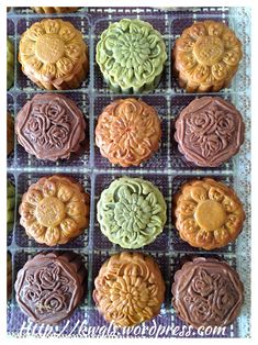 some cookies that are sitting on a tray together in the shape of flower petals and swirls