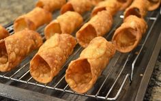 some food is sitting on a rack and ready to be cooked in the oven for consumption