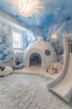 a child's bedroom decorated in blue and white with snow scene on the ceiling