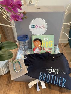 the big brother t - shirt is on display with other items