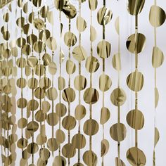 gold foiled circles hanging from the side of a wall