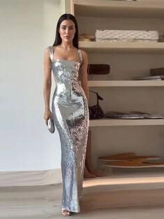 Expertly designed for a stunning and sophisticated look, the Socialite Silver Sequin Cut Out Sleeveless Maxi Dress is a must-have for any glamorous occasion. The intricate sequin detailing adds a touch of sparkle, while the cut-out sleeves and maxi length create an effortlessly chic silhouette. Elevate your style with this elegant dress. 100% Polyester Dry Clean Zipper Closure Due To High Demand-Please Allow 2-3 Weeks For Delivery Brand Size Dress Bust Waist Hip XS 0-2 31-32.5'' 23-24'' 31-34" S 4-6 33-35'' 25-26'' 35-37" M 8-10 35-36'' 27-28'' 38-39" L 12-14 38-40'' 29-31'' 40-42" XL 14-16 40-42'' 33.5-36'' 44-46" 2XL 18-20 42"-44" 37"- 40" 47"-50" 3XL 22-24 44"-46" 41"-46" 51"-55" 4XL 26-28 46"-48" 47"-50" 56-60" Summer Evening Party, Silver Sequin Dress, Womens Camisoles, Lantern Sleeve Dress, Autumn 2023, Sequin Maxi, Sequin Maxi Dress, Clothing Catalog, Stunning Gowns