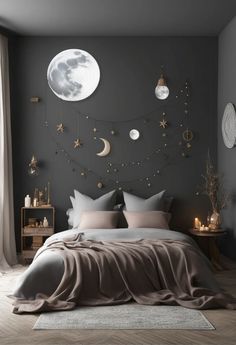 a bedroom with a large bed and moon decorations on the wall, along with candles