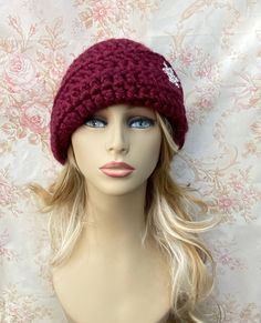 ⛄️⛄️⛄️ READY TO SHIP ⛄️⛄️⛄️ ❄️This women's cloche style hat is hand crocheted in super soft chunky 100% Acrylic.  It is a beautiful rich burgundy. It is adorned with a rhinestone snowflake button.     ❄️This hat has a lot of style and texture.  It measures 20" in circumference and stretches to 23" comfortably.  It's great for a adult or teen.  ⛄️I make my hats deeper than most, for a fun 1920's look, because of this they are perfect for women undergoing chemotherapy. They will cover your head well, and stay on. There are no irritating seams inside, and the yarn is soft.  💜Care instructions: Hand wash in cold water, roll in towel to remove excess water and dry flat.  It you like the style, I can make a custom hat in almost any color and yarn just for you. Just ask!! Womens Winter Hat, 1920s Looks, Cap Crochet, Bonnet Au Crochet, Cloche Hats, Vintage Style Hat, Bonnet Crochet, Chemo Caps, Chemo Hat