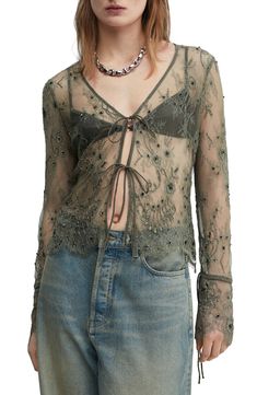 This gauzy mesh tie-front top is crafted with swirling embroidery and lustrous beadwork. 22" length (size 8) Ties at front V-neck Long sleeves 100% polyamide Spot clean Imported Sheer Blouse Outfit, Mesh Top Outfit, Flower Pants, Fairy Clothes, Mesh Shirt, Front Tie Top, Grey Stone, Lace Applique, Women Lace