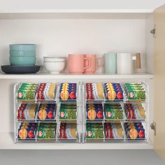 an organized pantry with canned food and cups