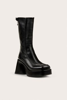 A mid-calf leather platform boot with a block heel and back zipper. — Mid-calf shaft height — Smooth leather — Platform — Back zipper — 4.7" heel height — Runs small, we recommend sizing up Chunky Platform Boots, Icon Clothing, Platform Boots Chunky, Evening Flats, Sandal Platform, Swimming Bag, Boot Accessories, Chunky Platform, Kids Sandals