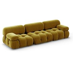 a yellow couch with buttons on the back and armrests, in front of a white background