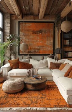 a living room filled with lots of furniture next to a large painting on the wall