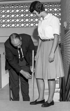 Rickards High School principal checking skirt length in Tallahassee.(1965) High School Principal, Worst Album Covers, Principals Office, High School Fashion, Funny Ads, School Principal, Little Shop Of Horrors, Good Old Days