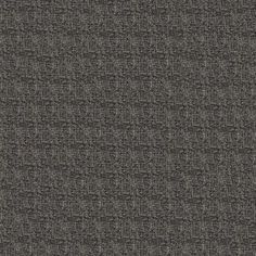 dark grey fabric textured upholstered to the wall