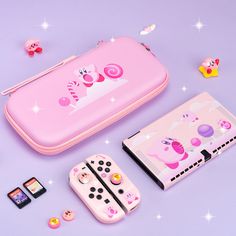 a pink nintendo wii game case next to other accessories on a purple surface with stars