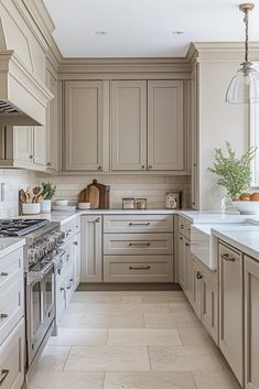 a kitchen with beige cabinets and white counter tops