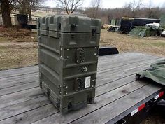 an army green case sitting on top of a trailer